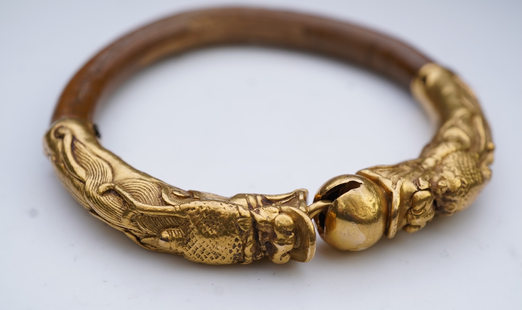 A gold and wood bangle, China, late 19th/early 20th century
